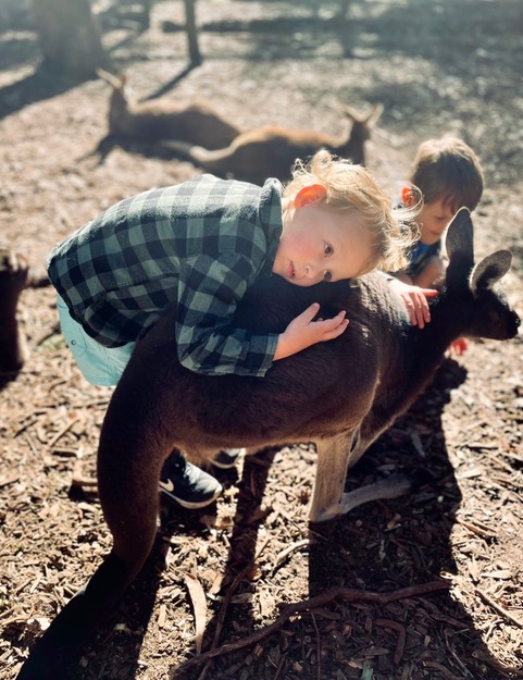 Ruben lovingly hugging a kangaroo