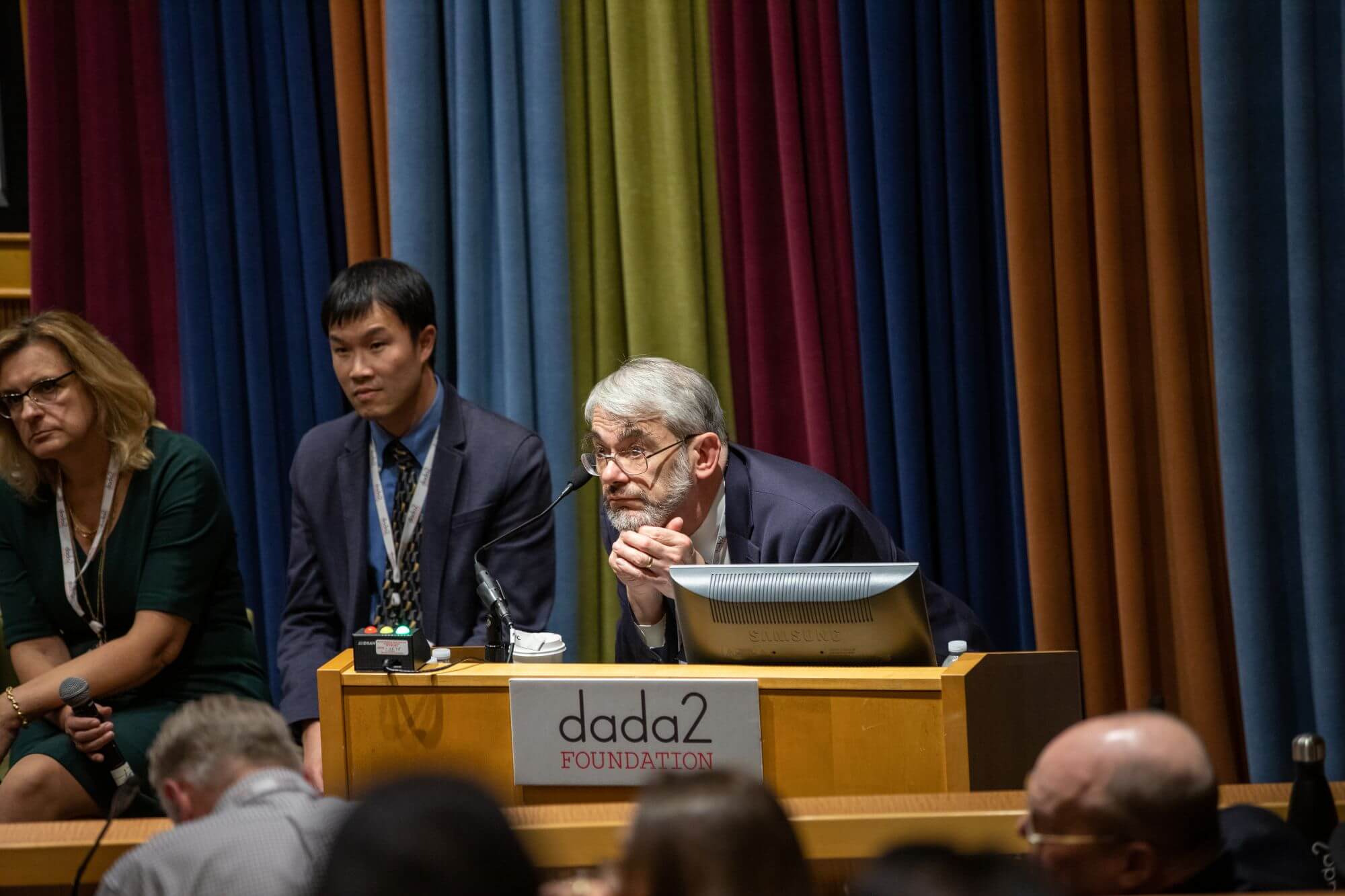 Dr. Dan Kastner listening thoughtfully during a DADA2 Foundation meeting