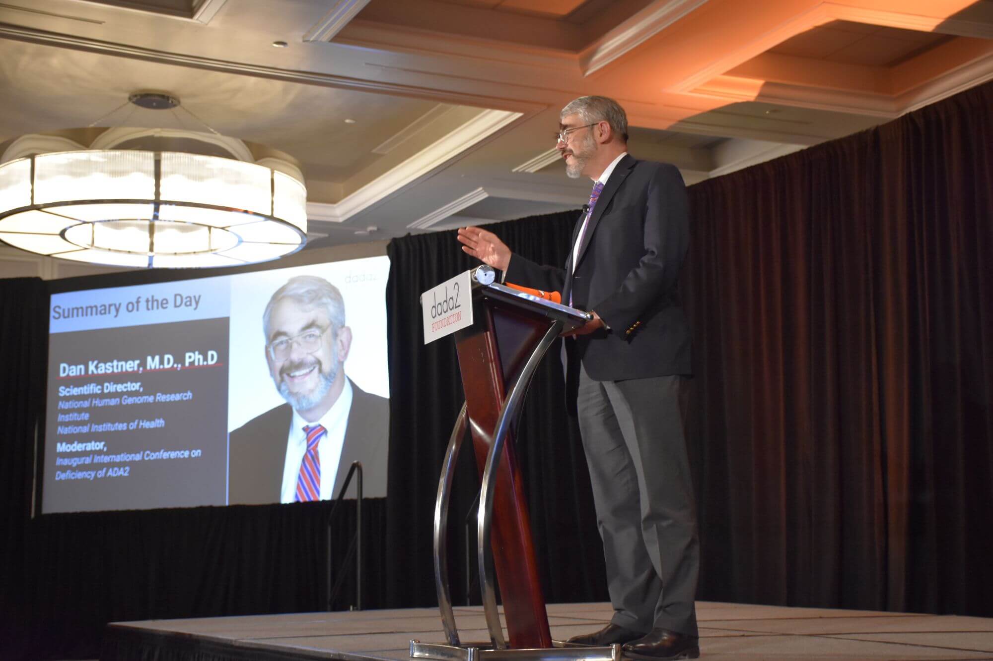 Dr. Dan Kastner speaking at a DADA2 Foundation conference